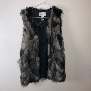 BCBG faux  fur vest
Great for dressing up or down 
Lightly worn